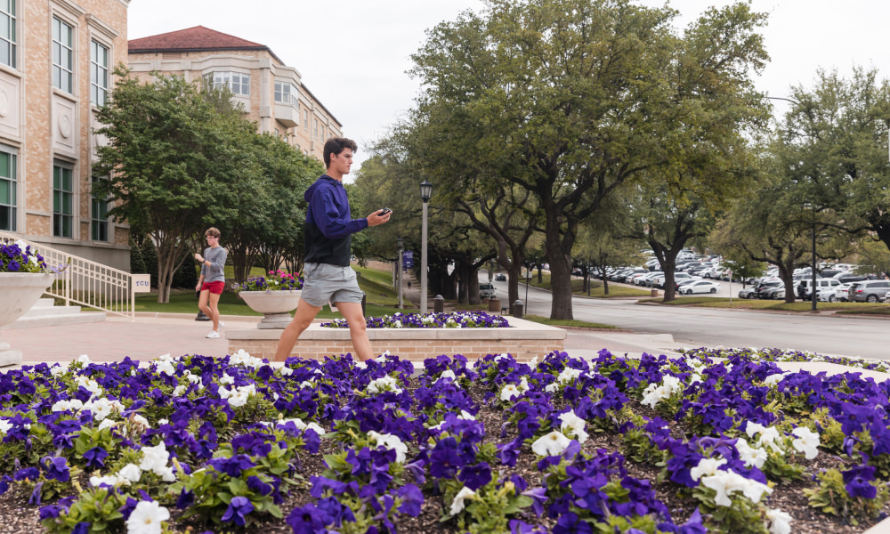 student walking on campus